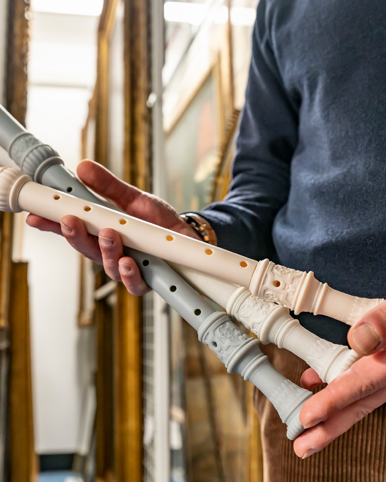 A collection of 3D recorders being held.